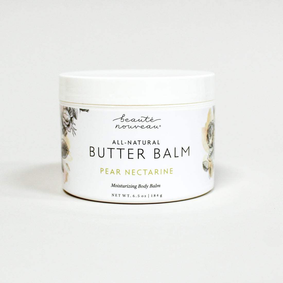 Jar of all-natural butter balm with a floral design on a white background