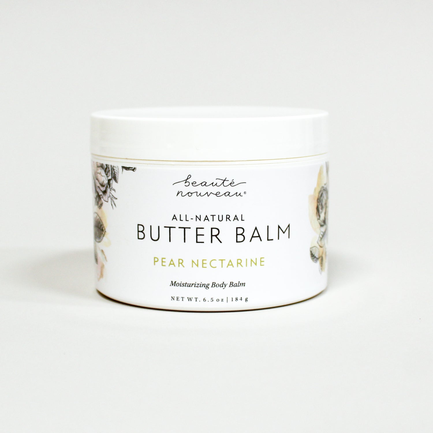 Jar of all-natural butter balm with a floral design on a white background