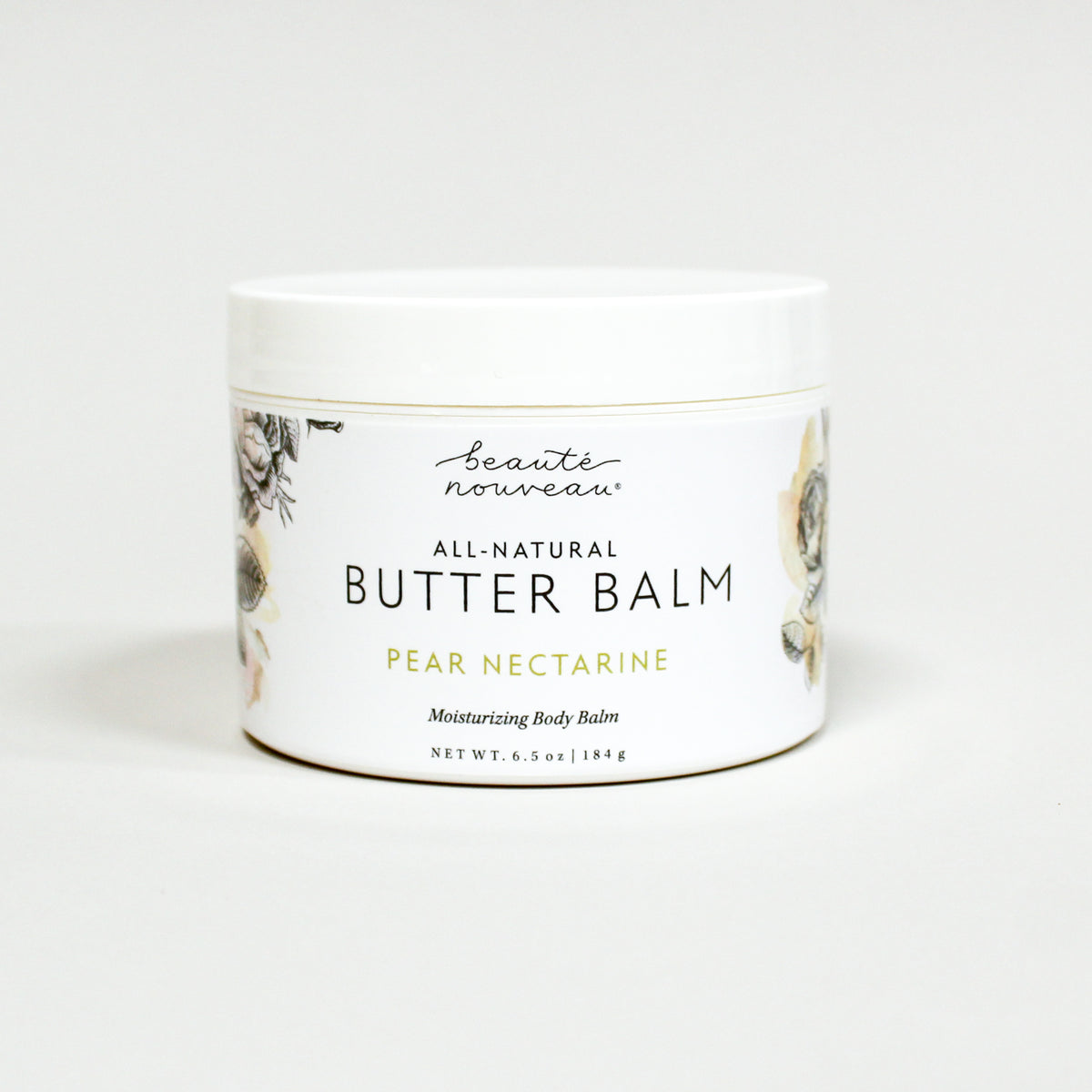 Jar of all-natural butter balm with a floral design on a white background