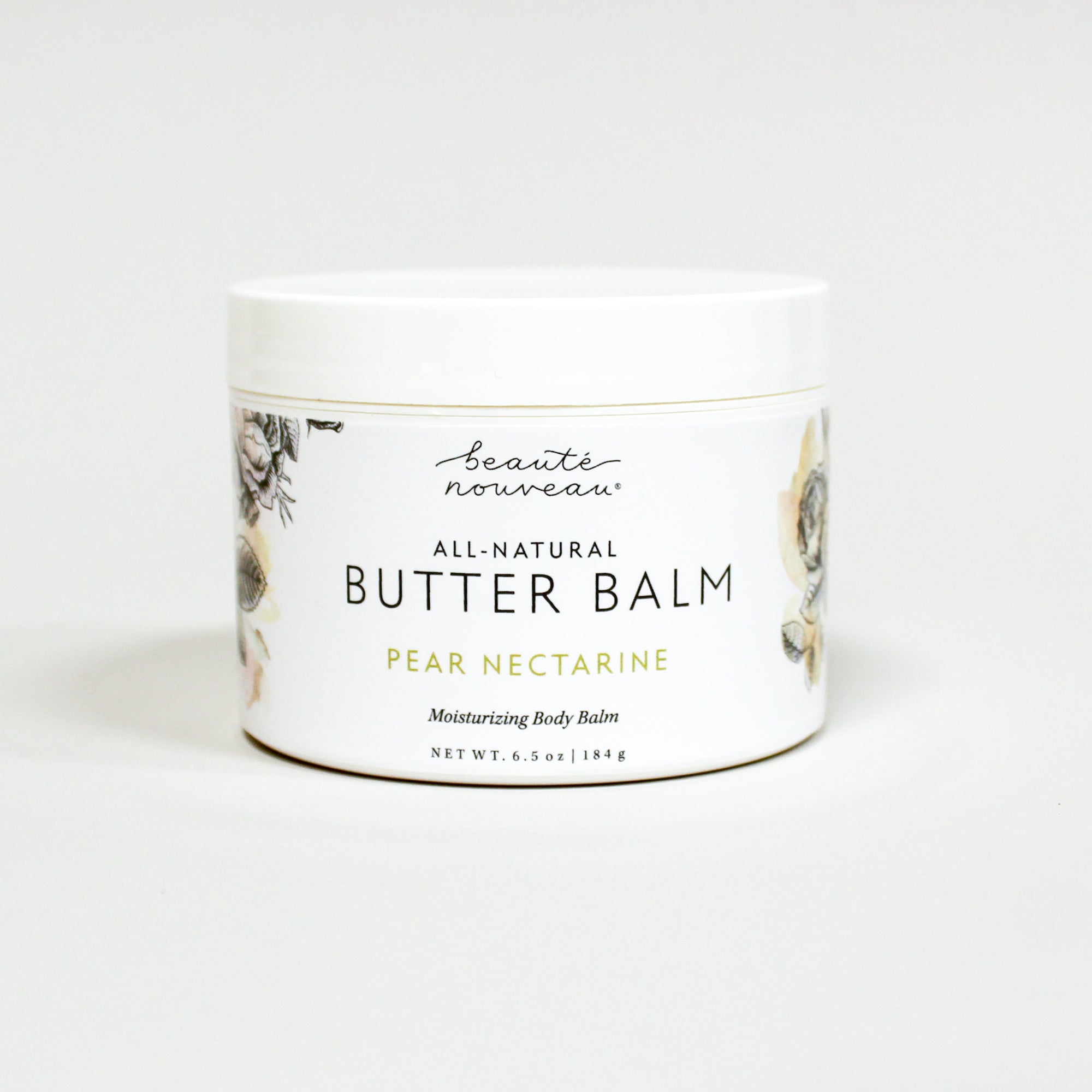 Jar of all-natural butter balm with a floral design on a white background