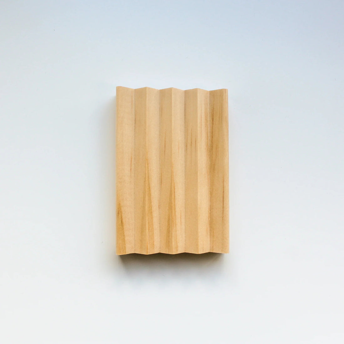 all-natural pine wood soap dish on white background.