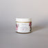 A jar of Crème Nouveau anti-aging face cream for dry, mature skin on  a light background.